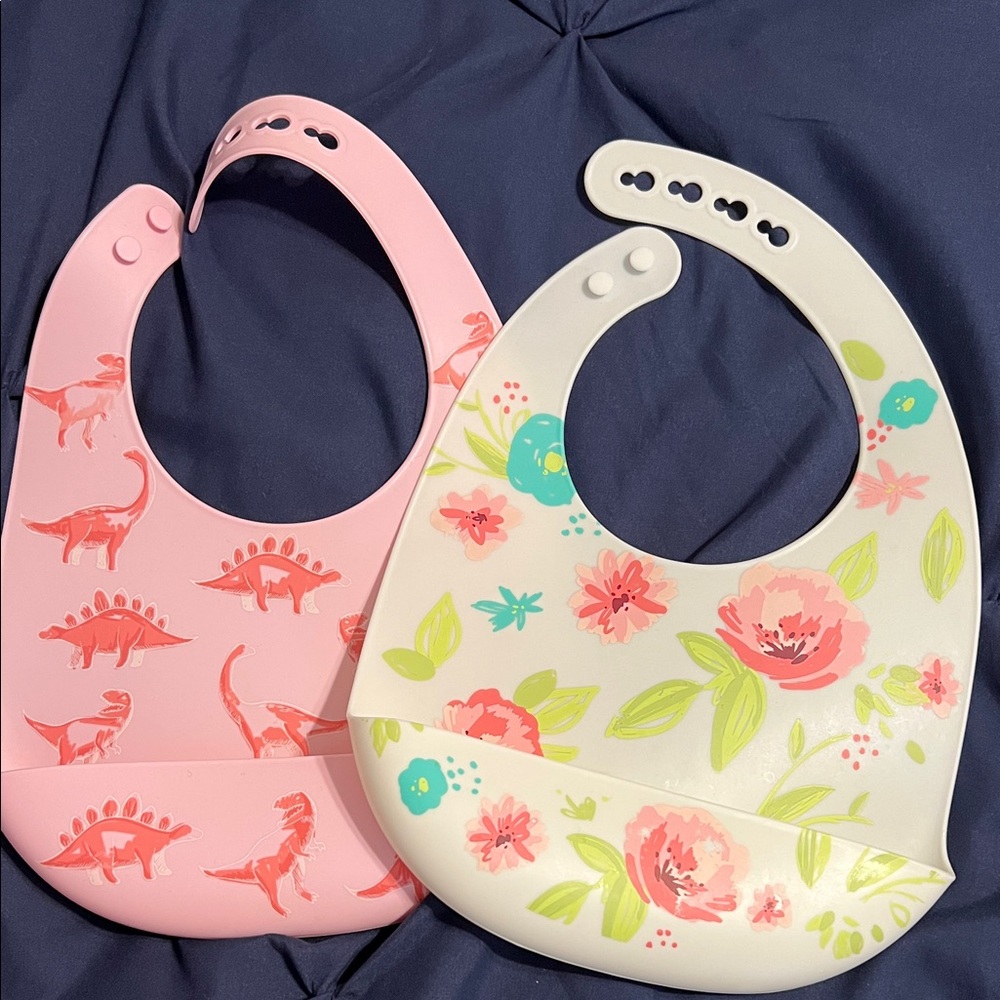 Nuby Silicone Bib with Crumb Catcher (2 Pack) in Flowers and Dinosaurs patterns